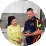 An Electrodry Technician presenting a demo to the woman