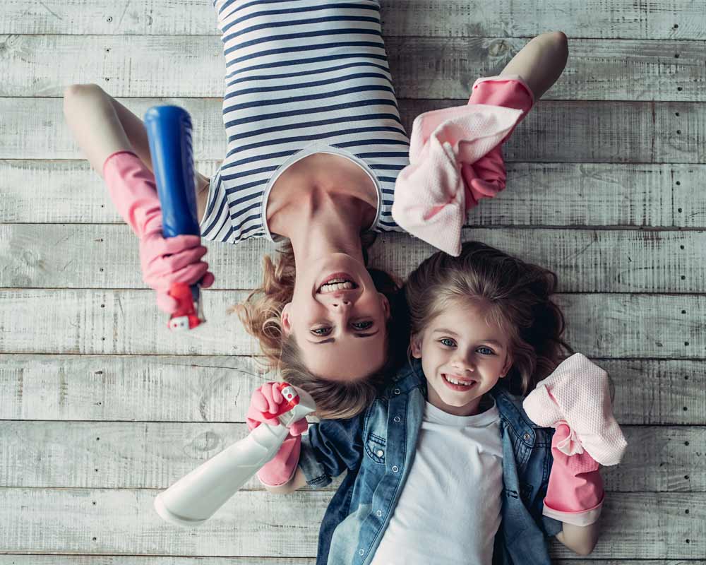 Mother Daughter having fun in Cleaning