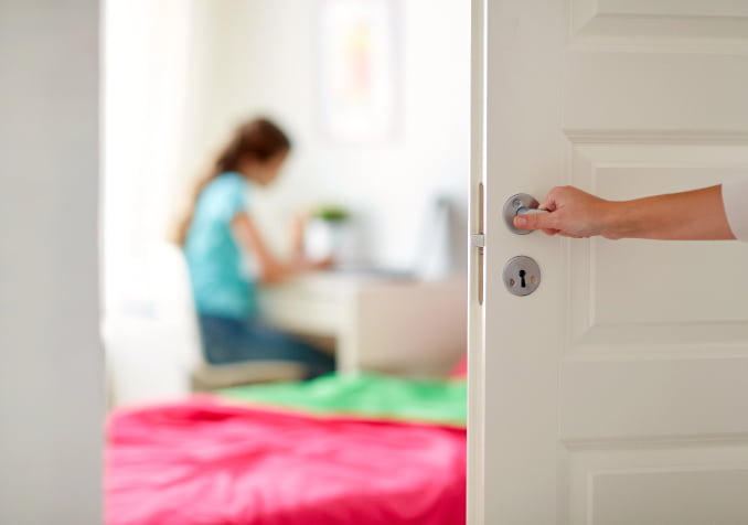 Hand Closing Door with a Girl focus on studying inside