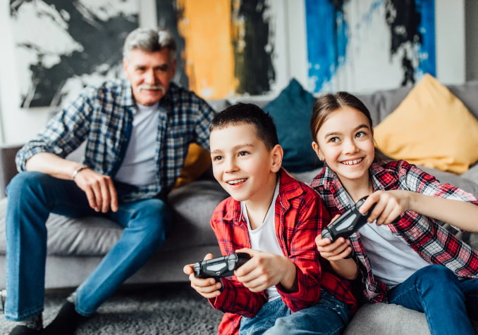 A Father Enjoying the view of his children while playing video game
