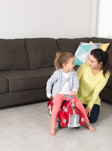 Hero image Mother And Daughter enjoy playing car toy