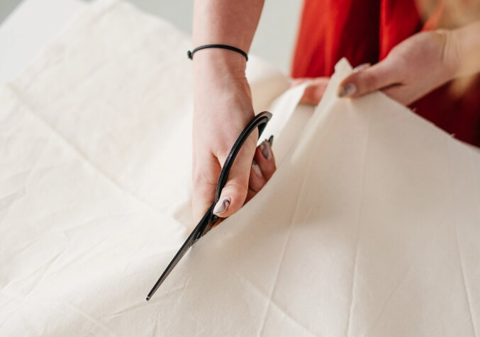 Cutting Cloth with Scissors