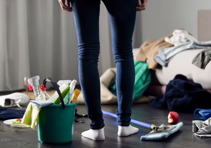 Woman Standing on Messy Floor