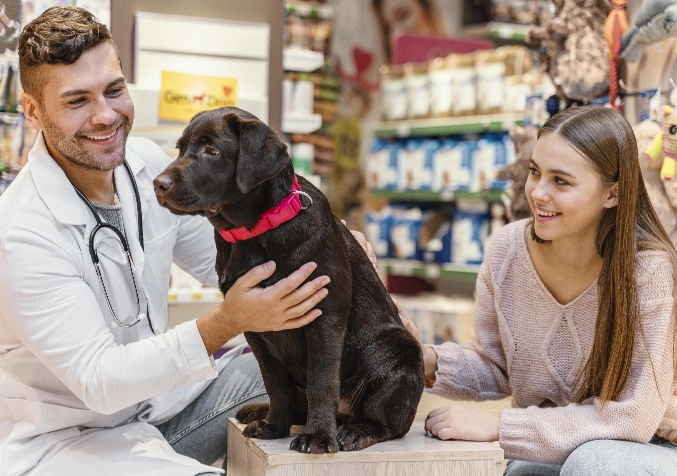 Veterinarian and Woman with Puppy