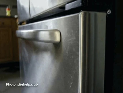 scratched stainless appliance refrigerator