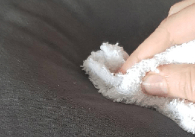 Black Couch Stain Dab with White Cloth