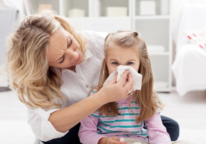 Mother Wipes Nose Child