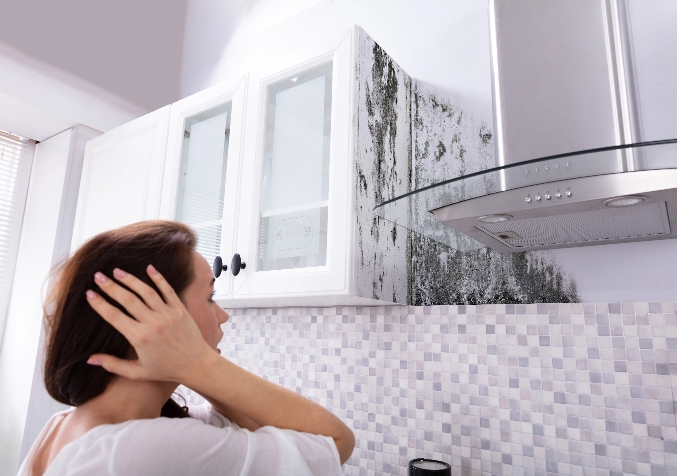 Upset Woman Moldy Cupboard