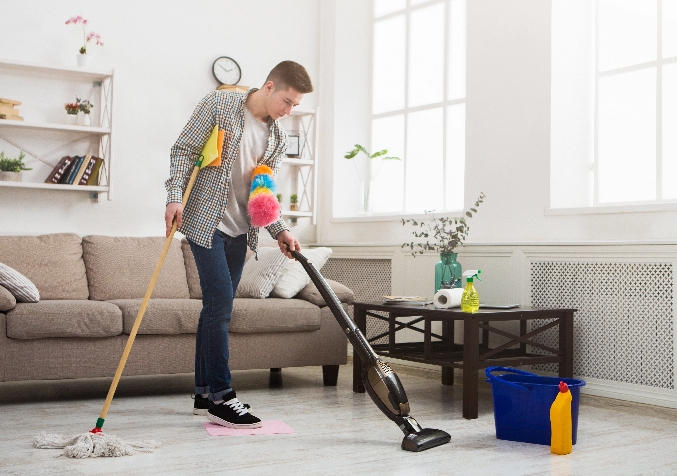 Person Multitasking Cleaning in Living Room