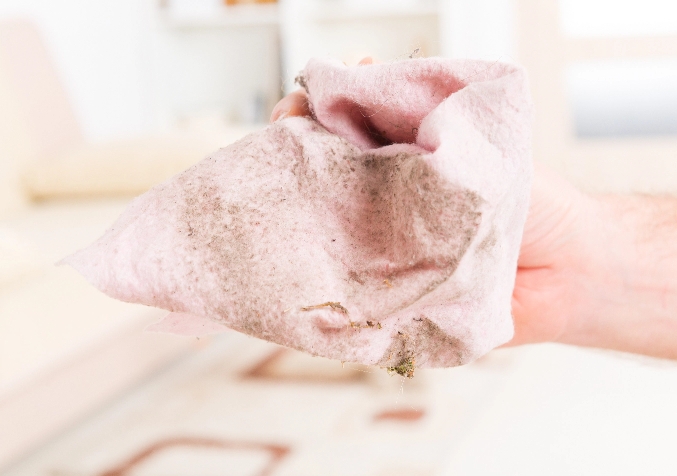 Hand Holding Dirty Cloth