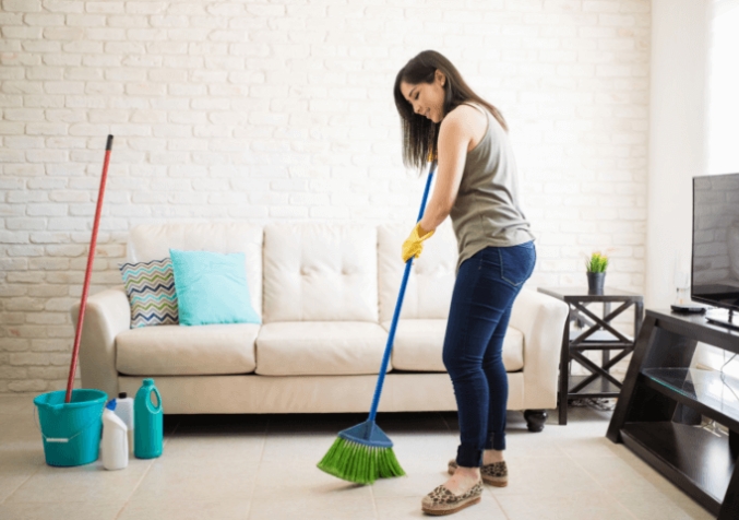 Woman Cleaning the Tiles
