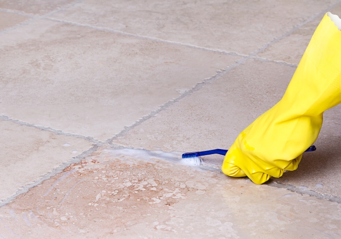 Cleaning the grout using a toothbrush