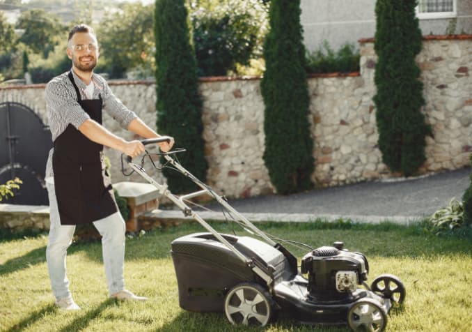Electrodry Man mowing lawn